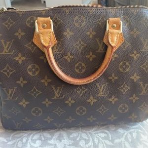 A Vintage authentic Louis Vuitton speedy 30 handbag!